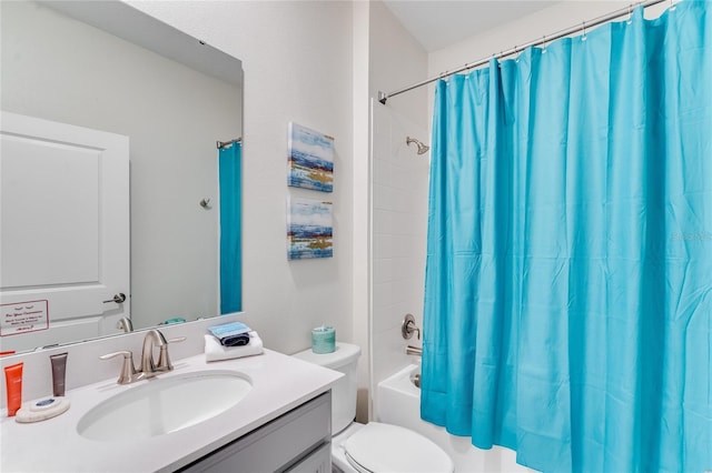 full bathroom featuring vanity, shower / tub combo, and toilet