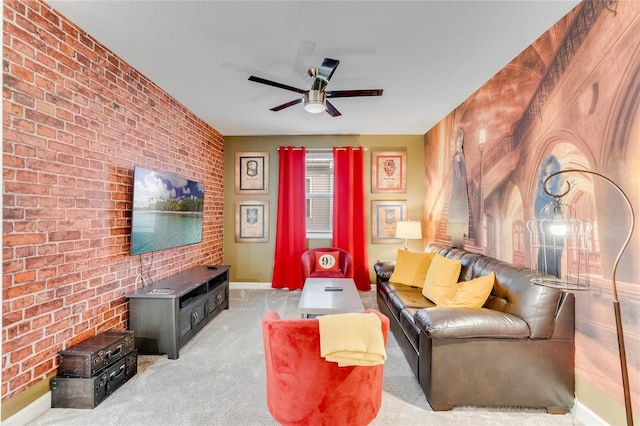 living room featuring light colored carpet, ceiling fan, and brick wall