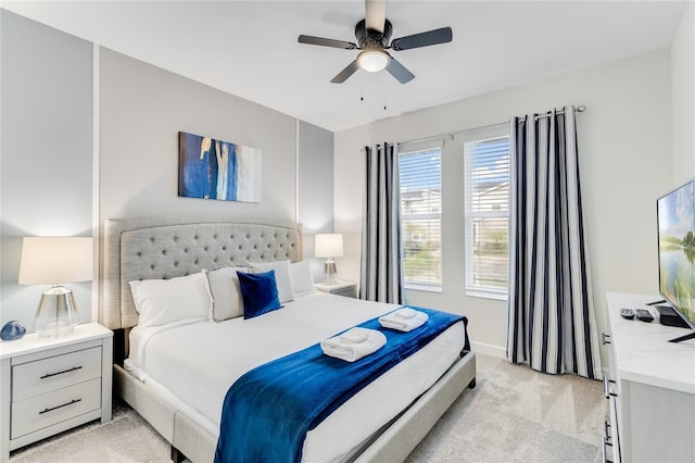 bedroom with light colored carpet and ceiling fan