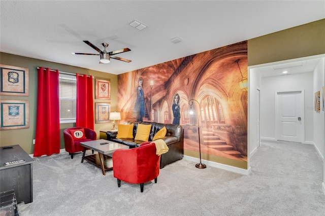 carpeted living room with ceiling fan