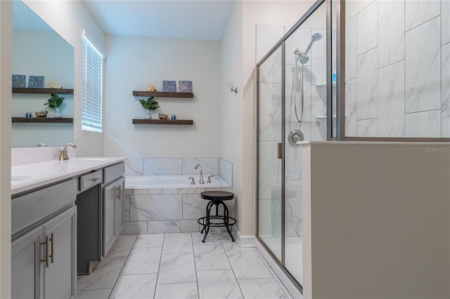 bathroom featuring vanity and shower with separate bathtub