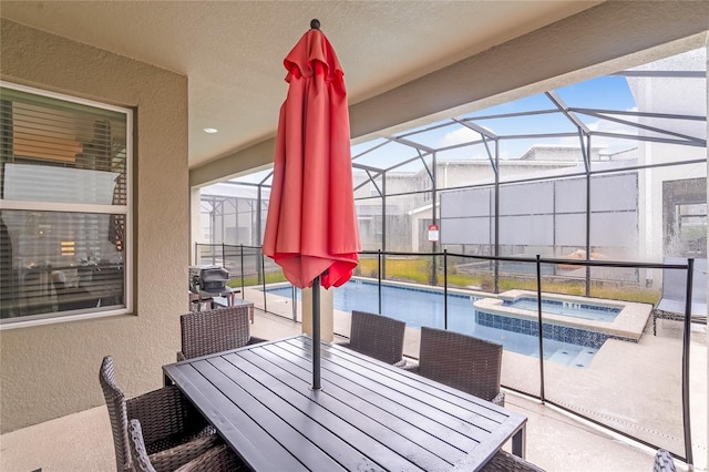 view of patio / terrace featuring a pool with hot tub and a lanai