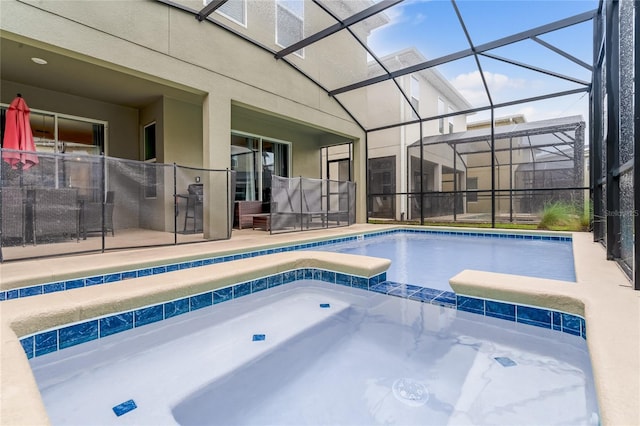 view of swimming pool featuring an in ground hot tub and glass enclosure