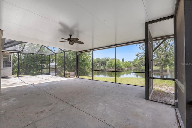 unfurnished sunroom with a water view