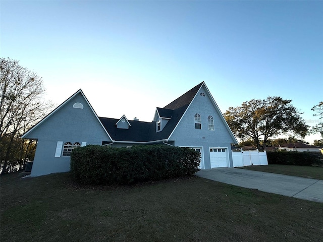 view of front of house with a garage and a front yard