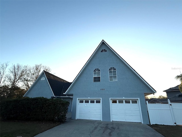 view of side of property with a garage