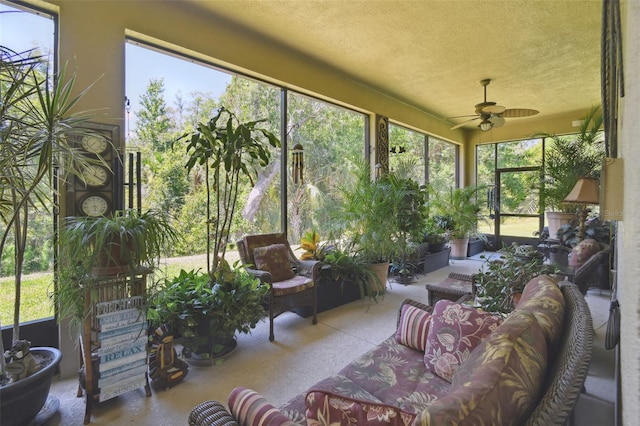 sunroom / solarium featuring ceiling fan