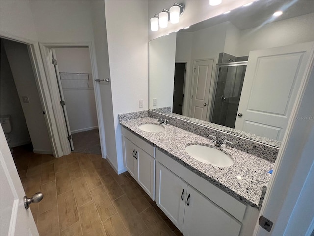 bathroom featuring vanity and walk in shower