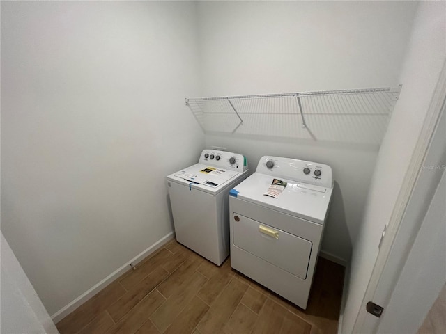 washroom with washing machine and dryer