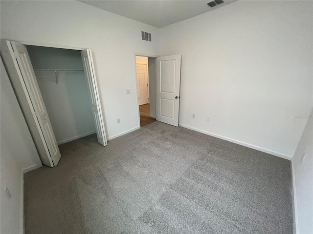 unfurnished bedroom featuring a closet and carpet