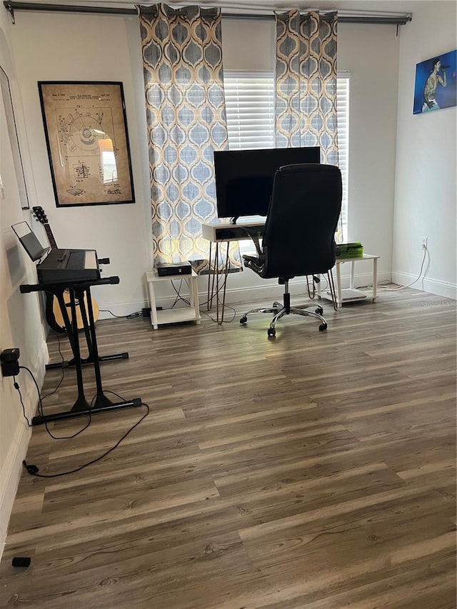 office space with wood-type flooring