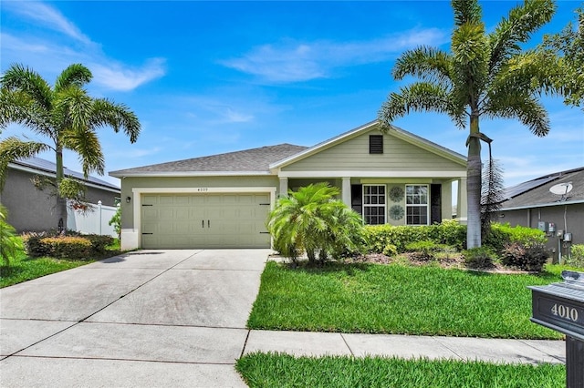 ranch-style house with a garage and a front lawn