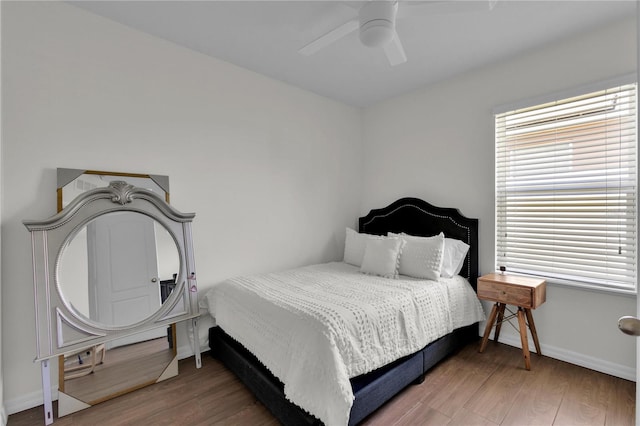 bedroom featuring wood-type flooring and ceiling fan