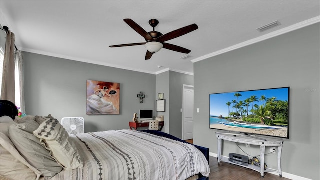 bedroom with hardwood / wood-style flooring, ornamental molding, and ceiling fan