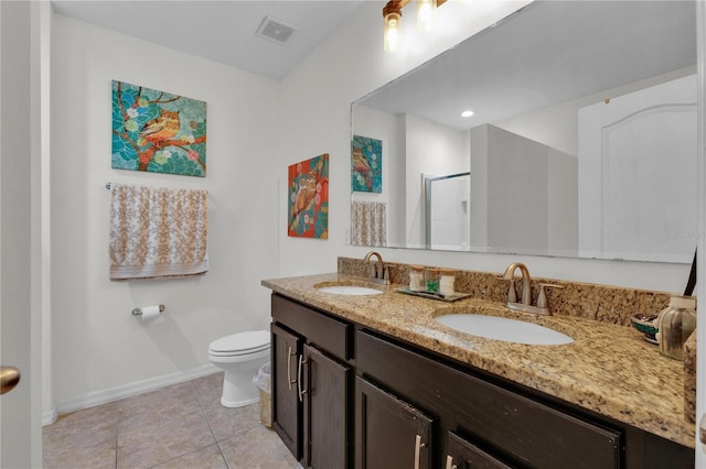 bathroom with tile flooring, dual sinks, toilet, and large vanity