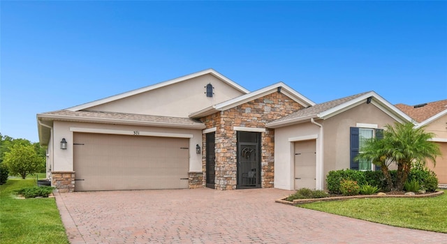 ranch-style house featuring a garage and a front yard