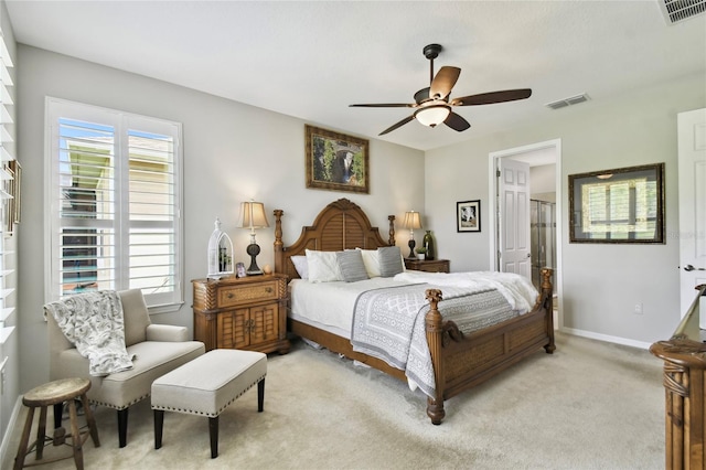 carpeted bedroom with multiple windows and ceiling fan