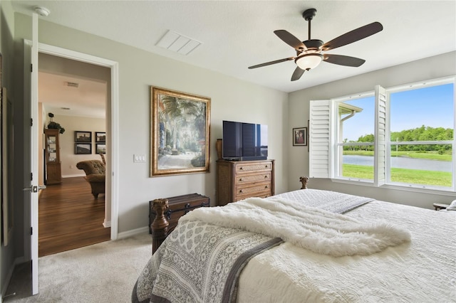 carpeted bedroom with ceiling fan