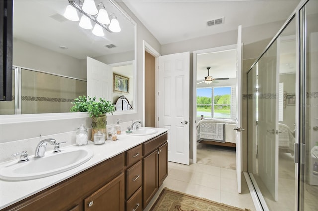 bathroom featuring tile patterned floors, vanity, and an enclosed shower