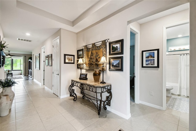 hallway with light tile patterned floors