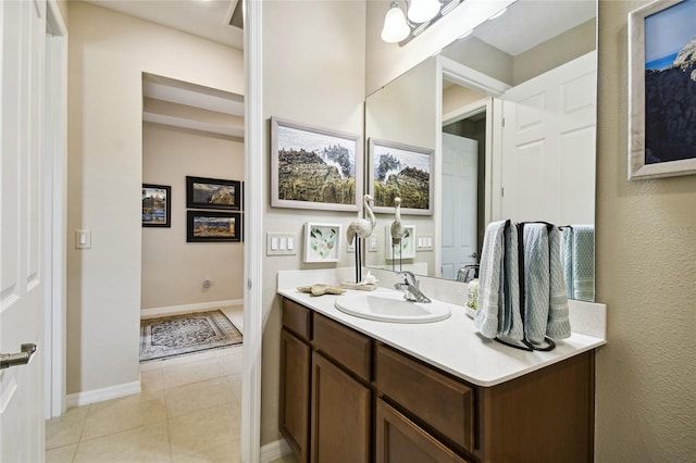 bathroom featuring tile patterned flooring and vanity