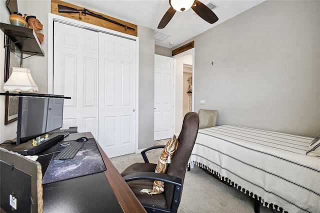 bedroom with light colored carpet, a closet, and ceiling fan