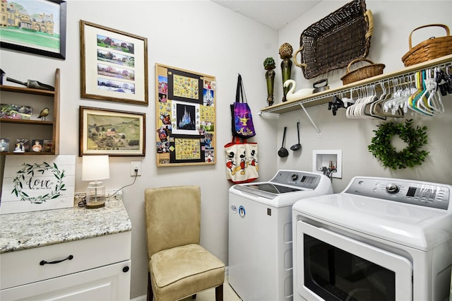 clothes washing area featuring washing machine and dryer