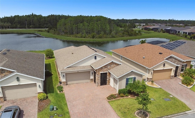 birds eye view of property featuring a water view