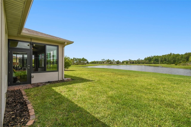 view of yard with a water view