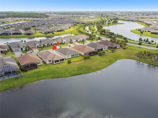 birds eye view of property featuring a water view