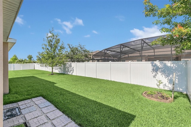 view of yard with a lanai