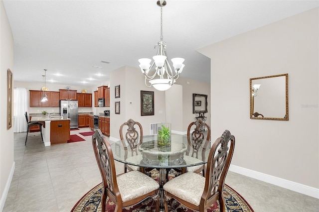 dining room with a notable chandelier and light tile flooring