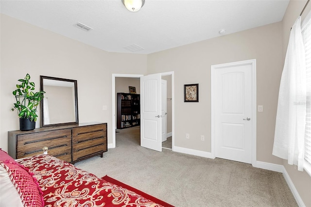 bedroom with light carpet