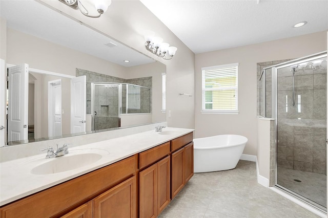 bathroom with shower with separate bathtub, tile flooring, dual sinks, and large vanity