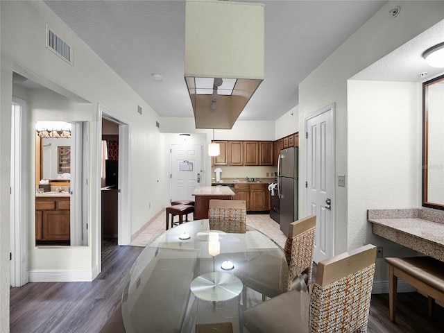 dining area with hardwood / wood-style flooring