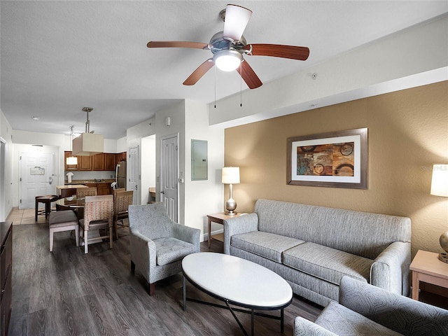 living room with hardwood / wood-style flooring and ceiling fan