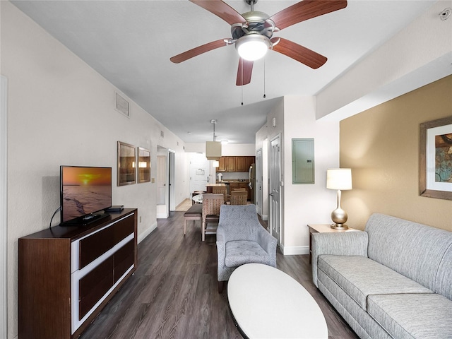 living room featuring dark wood-type flooring and ceiling fan