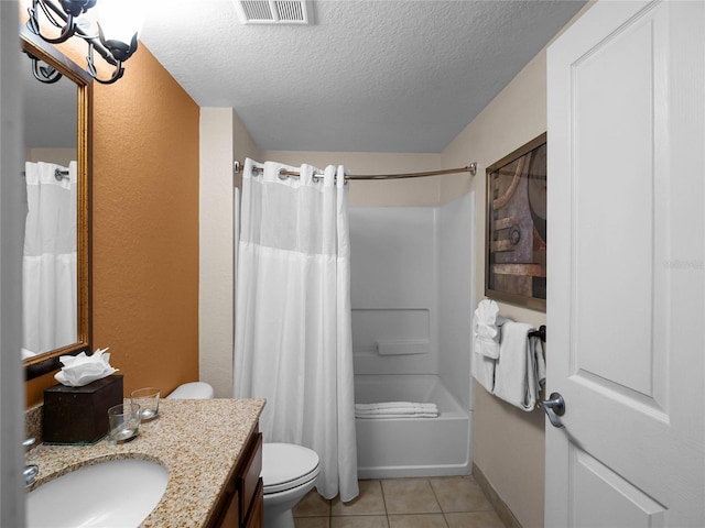 full bathroom featuring a textured ceiling, tile flooring, shower / bath combo, large vanity, and toilet