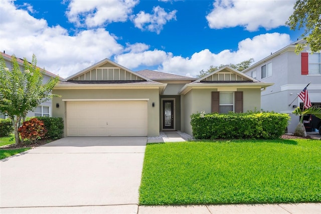 view of front of property with a garage and a front lawn