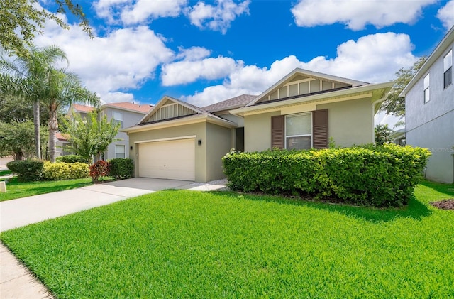 view of front of home featuring a front lawn and a garage