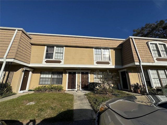 view of property featuring a front yard