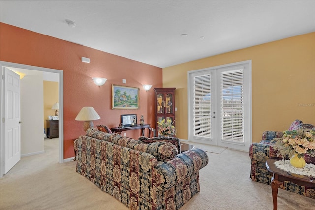 living room with light carpet and french doors