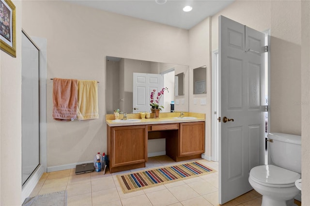 bathroom featuring toilet, tile patterned floors, an enclosed shower, and dual bowl vanity