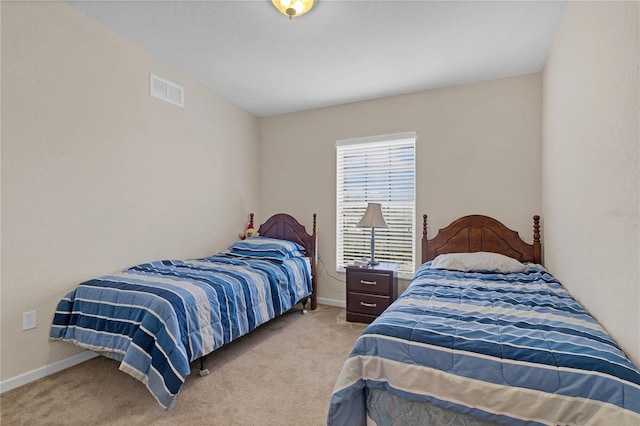 bedroom with light carpet