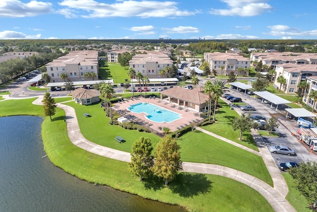 birds eye view of property with a water view