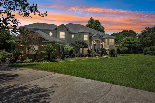 view of front of home featuring a yard