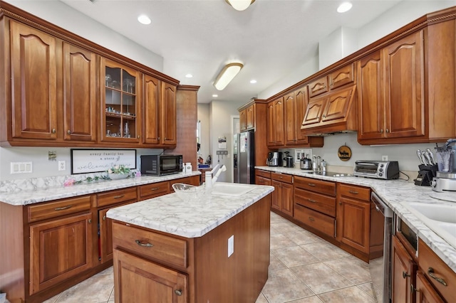 kitchen with premium range hood, black appliances, a center island, sink, and light tile floors