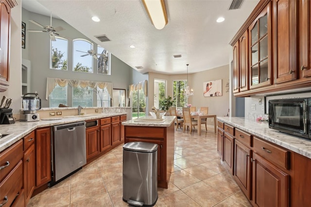 kitchen with a center island, hanging light fixtures, ceiling fan, light tile flooring, and dishwasher