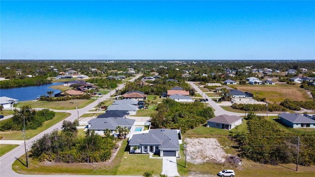 birds eye view of property featuring a residential view and a water view