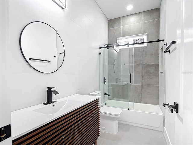 full bathroom with toilet, vanity, and shower / bath combination with glass door